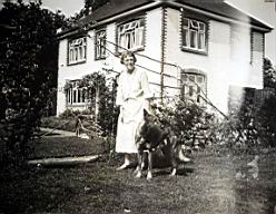 Mary Croasdaile with dog at Wood
                          Lodge.jpg